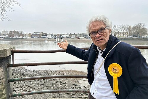 Fulham Liberal Democrat Roy Pounsford points at the River Thames